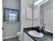 Well-lit bathroom featuring a window and modern fixtures at 956 Chula Ct, The Villages, FL 32159
