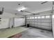 Spacious garage with built-in storage cabinets at 956 Chula Ct, The Villages, FL 32159
