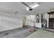 Spacious garage includes ample storage cabinets, laundry area, and utility connections at 956 Chula Ct, The Villages, FL 32159
