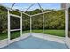 Enclosed patio with lush greenery providing privacy and tranquility at 956 Chula Ct, The Villages, FL 32159
