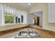 Kitchen sink with stainless steel faucet, granite counters, and window overlooking the backyard at 956 Chula Ct, The Villages, FL 32159