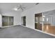 Sunroom featuring sliding glass doors to inside and outside, providing versatile living space at 956 Chula Ct, The Villages, FL 32159