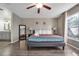 Bright bedroom with a queen bed and full bathroom at 1150 Angela Ridge Ct, Kissimmee, FL 34747