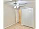 Bedroom with closet, ceiling fan and tiled floor at 2059 Newtown Rd, Groveland, FL 34736