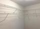 Empty walk-in closet with white wire shelving, ready for organization at 2059 Newtown Rd, Groveland, FL 34736