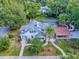 Aerial view of the well-maintained property with pool, lush landscaping, and inviting curb appeal at 351 W 10Th Ave, Mount Dora, FL 32757