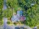 Lush property as seen from above, featuring a pool and mature tree coverage at 351 W 10Th Ave, Mount Dora, FL 32757