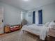 Comfortable bedroom featuring a large window, a bench, and a wooden frame bed at 351 W 10Th Ave, Mount Dora, FL 32757