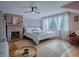 Bright bedroom featuring hardwood floors, neutral walls, and a rock fireplace with lots of natural light at 351 W 10Th Ave, Mount Dora, FL 32757