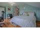 A bright bedroom featuring hardwood floors, neutral walls, and a large closet in the background at 351 W 10Th Ave, Mount Dora, FL 32757