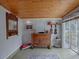Bonus room featuring wood ceiling, yoga mats, and built-in cabinet with unique decorative elements at 351 W 10Th Ave, Mount Dora, FL 32757