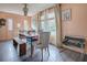 Dining room with dark floors, a wood table, modern seating, and neutral walls at 351 W 10Th Ave, Mount Dora, FL 32757