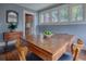 Cozy dining room with hardwood floors and large windows offering plenty of natural light at 351 W 10Th Ave, Mount Dora, FL 32757