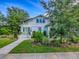 Beautiful two-story home with well-maintained lawn, landscaping, and white siding at 351 W 10Th Ave, Mount Dora, FL 32757