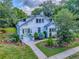 Charming two-story home with a well-manicured lawn and a light green door at 351 W 10Th Ave, Mount Dora, FL 32757