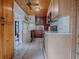 Well-equipped kitchen with custom cabinets, stainless steel appliances, and hardwood floors at 351 W 10Th Ave, Mount Dora, FL 32757