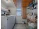 Bright laundry room with modern washer/dryer, ample storage, and a window for natural light at 351 W 10Th Ave, Mount Dora, FL 32757