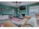 Comfortable living room with fireplace, sofas, wood trim, and a decorative rug at 351 W 10Th Ave, Mount Dora, FL 32757