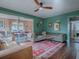 Inviting living room with a colorful rug, comfortable sofas, and an open dining area at 351 W 10Th Ave, Mount Dora, FL 32757