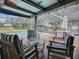 A lovely seating area and pool, surrounded by a screened enclosure, is perfect for outdoor entertaining at 351 W 10Th Ave, Mount Dora, FL 32757