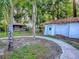 The backyard features green grass, a shed, and mature trees in a beautiful, private setting at 351 W 10Th Ave, Mount Dora, FL 32757