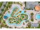 Aerial view of a large resort-style pool and water park, complete with mini golf at 4847 Clock Tower Dr, Kissimmee, FL 34746