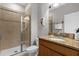 The well maintained bathroom features granite countertops, a modern vanity, and a glass shower at 4847 Clock Tower Dr, Kissimmee, FL 34746