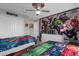 bedroom featuring an avengers theme, comic book wallpaper, and two twin beds at 4847 Clock Tower Dr, Kissimmee, FL 34746