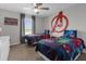 This comfortable bedroom has twin beds, an avengers theme and lots of natural light at 4847 Clock Tower Dr, Kissimmee, FL 34746
