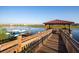 Picturesque dock overlooking a serene lake, with kayak rentals available at 4847 Clock Tower Dr, Kissimmee, FL 34746