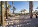 Relaxing hammocks on a sandy beach, nestled between palm trees near the lake at 4847 Clock Tower Dr, Kissimmee, FL 34746