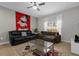 Open-concept living room with tile flooring, ceiling fan, and comfortable seating at 4847 Clock Tower Dr, Kissimmee, FL 34746