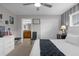 Primary bedroom suite featuring stylish decor, a ceiling fan, and a view to the ensuite bathroom at 4847 Clock Tower Dr, Kissimmee, FL 34746