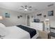Comfortable main bedroom suite featuring a ceiling fan, dresser, and mirror at 4847 Clock Tower Dr, Kissimmee, FL 34746