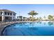 Stunning resort-style pool with palm trees and a well-appointed clubhouse at 4847 Clock Tower Dr, Kissimmee, FL 34746