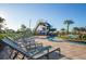Resort-style pool area with a water slide and plenty of lounge chairs at 4847 Clock Tower Dr, Kissimmee, FL 34746