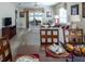 Dining area with table and chairs, open to living room at 2030 Alfredo Ave, The Villages, FL 32159