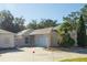 Two-story home with a two-car garage and landscaped yard at 2030 Alfredo Ave, The Villages, FL 32159