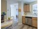 Kitchen with light wood cabinets and stainless steel appliances at 2030 Alfredo Ave, The Villages, FL 32159