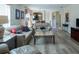 Living room with beige sofas and a wood coffee table at 2030 Alfredo Ave, The Villages, FL 32159