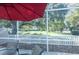 Enjoy the view from this screened patio, overlooking a green space at 2030 Alfredo Ave, The Villages, FL 32159