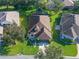 Aerial shot showcasing the home's landscaping and curb appeal at 22204 Caledonia Dr, Leesburg, FL 34748