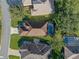 An aerial view shows the layout of the house, pool and surrounding area at 22204 Caledonia Dr, Leesburg, FL 34748