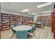 Community library featuring bookshelves that wrap around the room and tables with chairs at 22204 Caledonia Dr, Leesburg, FL 34748