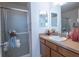 Updated bathroom with shower and double vanity at 2479 Cedar Key Ln, The Villages, FL 32162