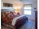 Bright bedroom with a king-size bed and ceiling fan at 2479 Cedar Key Ln, The Villages, FL 32162