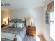 Main bedroom with king-size bed and lots of natural light at 2479 Cedar Key Ln, The Villages, FL 32162