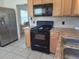 Well-lit kitchen features updated appliances and plenty of counter space at 405 N Rhodes St, Mount Dora, FL 32757