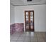 Living room featuring a tiled floor and french doors at 405 N Rhodes St, Mount Dora, FL 32757