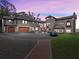Striking home features a circular driveway, brick accents, a three-car garage and manicured lawn at 6118 Dora Dr, Mount Dora, FL 32757